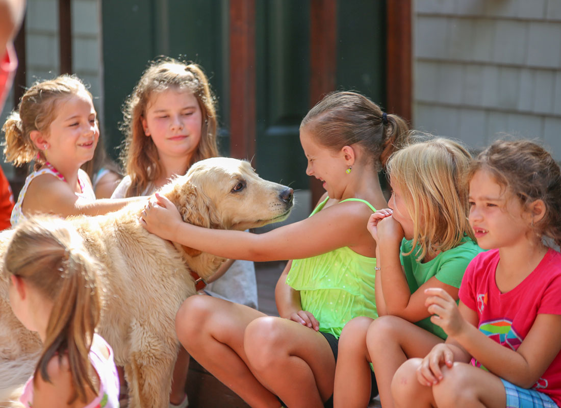 girls at summer camp with dog 