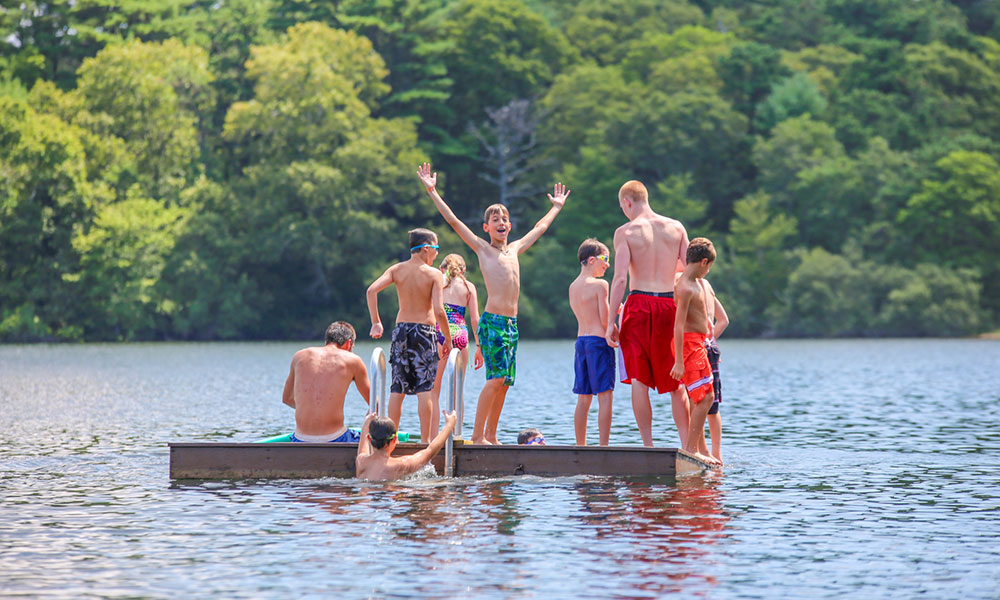 kids playing on lake at summer camp